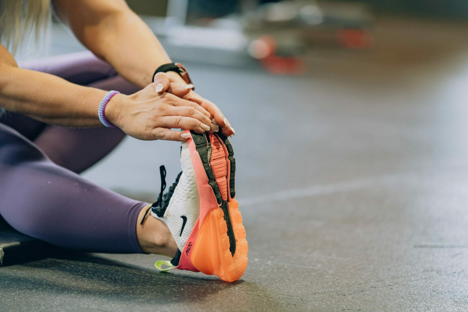 Closeup woman stretching after training at LFT GYM